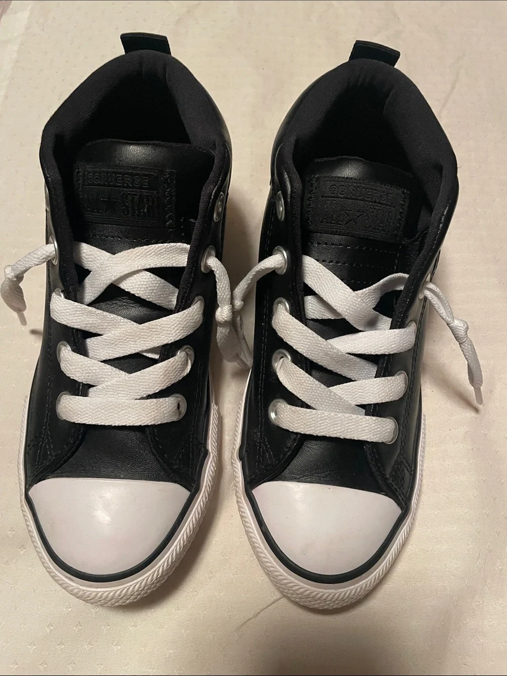Converse Kids Black High-Top Sneakers with White Accents.  Leather look.